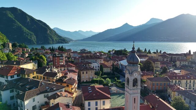 early morning sunlight bathes peaceful village streets and shimmering waters with golden glow