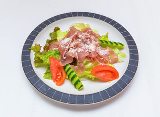 Enjoy this delightful prosciutto salad, a symphony of fresh flavors and textures. Perfect for showcasing healthy eating and culinary inspiration.
