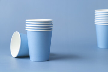 Disposable light blue paper cups closeup, mockup, copy space. No plastic biodegradable single-use