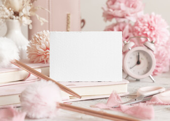 Horizontal blank card near romantic pink decor, hearts and flowers closeup, Valentines spring mockup