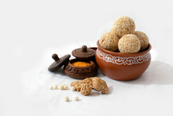 makar sankranti , Till ke laddu made from Amaranth seed in Bowl on Brown background Indian sweet for traditional festival