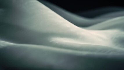 Abstract close-up of rippling white translucent fabric against a dark background - Powered by Adobe