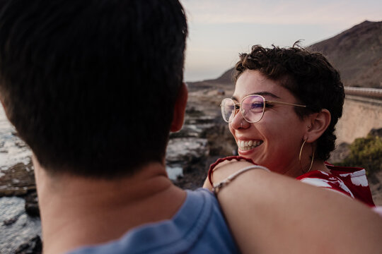 Smiling woman feeling happy with man on holiday