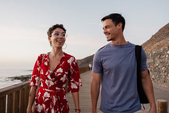 Happy couple walking during beach holiday in Canary Islands