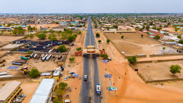 Aerial view of the long IBB Way road stretching through the city, framed by the iconic archway, Katsina, Katsina, Nigeria.