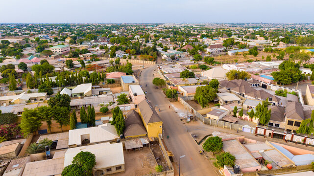 Aerial view of vibrant residential area with roads cutting through buildings and scattered trees, Katsina, Katsina, Nigeria.