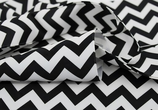 Dramatic visual of black and white chevron pattern textile folds abstract