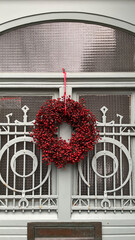 Red Christmas wreath on the door