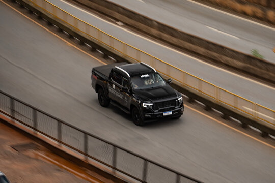 Black Foton Tunland front view three quarters, Pickup truck driving on highway