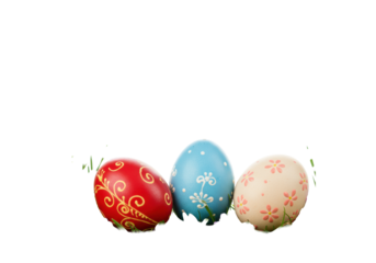 Three vibrantly colored, intricately patterned Easter eggs on a polished wooden surface, framed by green grass and purple flowers, with white copy space. Festive spring holiday atmosphere.