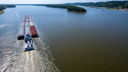 Aerial Journey of a Cargo Barge Along the Mighty Mississippi River