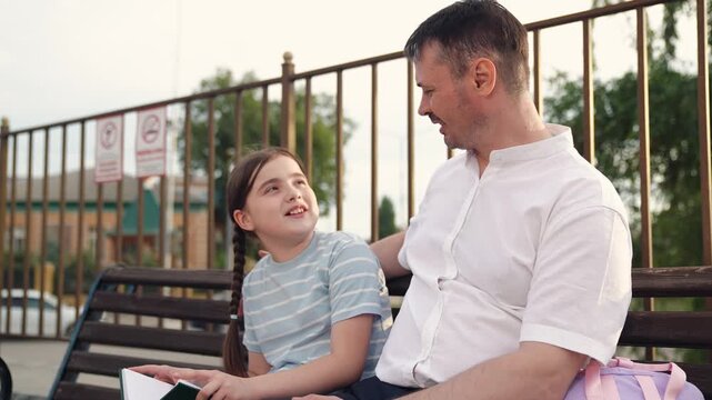 child parent father talking bench, happy family concept, parent with child kid girls sitting bench park, happy father concept, man child relaxing outdoor, laughter smile kid child face, child father