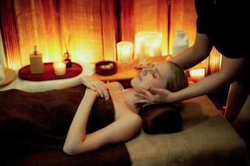 Caucasian woman enjoying relaxing anti-stress head massage and pampering facial beauty skin...