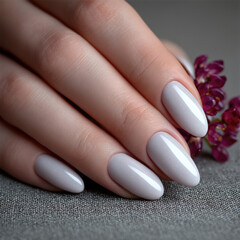 Elegant manicure with almond shaped nails, soft pastel polish, smooth skin, and gentle lighting, creating sophisticated feminine style