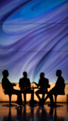 Naklejka premium Blurred image of a television studio with silhouettes of people discussing talk show topics against an abstract blue-purple background 