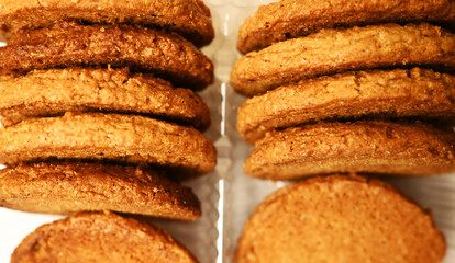 Oatmeal cookies in package background. Tasty pastry