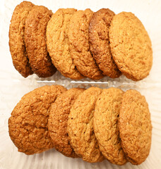 Oatmeal cookies in package background. Tasty pastry
