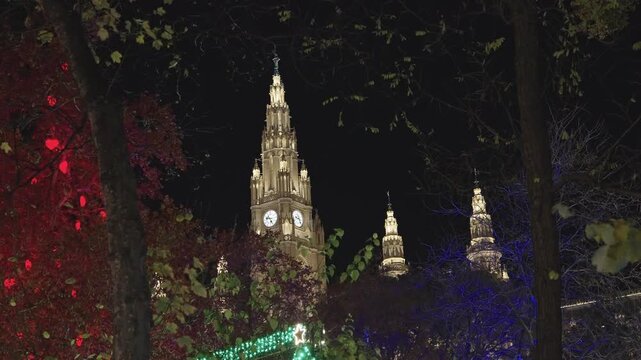 Vienna City Hall Towers Illuminated at Night Through Autumn Trees.Captured on November 16,2025.