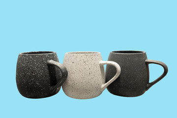 Three gray ceramic mugs