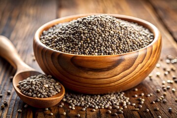 Wooden bowl filled with perilla seeds and a wooden spoon on a rustic wooden surface close up shot
