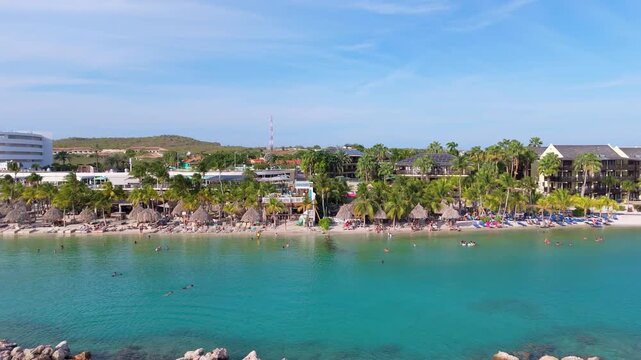 Aerial Tropical Beach Scene with Beach Club, Palms, and Swimmers in Cura&ccedil;ao