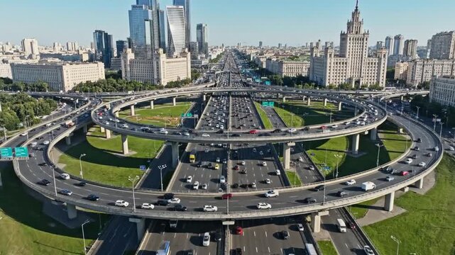 Aerial view of a busy highway interchange with multiple overpasses and traffic.