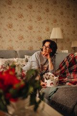 woman sitting on the sofa during the Christmas period