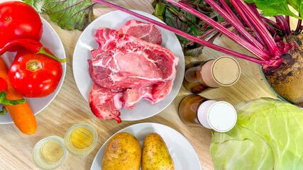 Raw meat nestles with vibrant veggies and vintage pickles, invoking ancient autumn feasts and quirky Harvest Moon celebrations