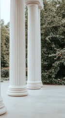 Naklejka premium Classical architecture featuring tall white columns surrounded by lush greenery in an outdoor setting during daylight