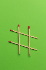 large matches on a green background