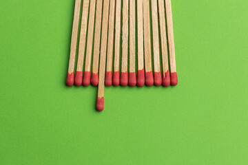 large matches on a green background