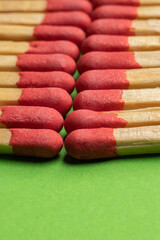 large matches on a green background