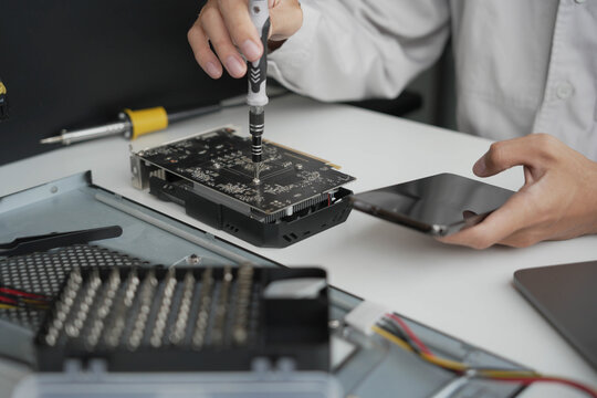 Closeup hand of computer hardware technician dissemble and  fixing computer PC.