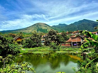 Fototapeta premium Beautiful Tropical Mountain Village Landscape with Lake