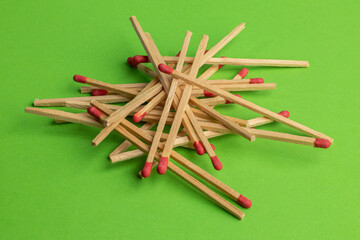 large matches on a green background