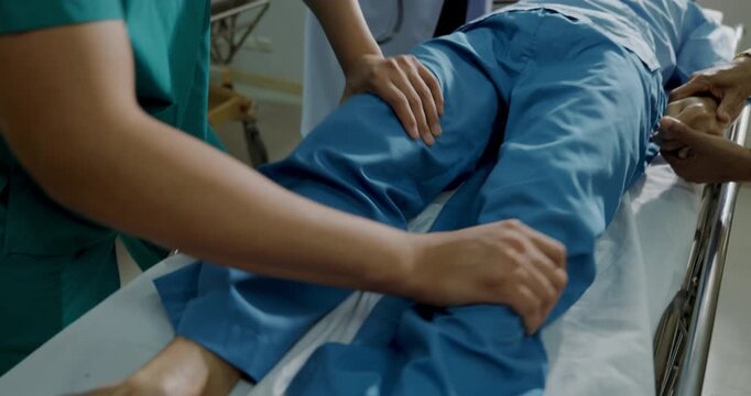 Hospital concept of 4k Resolution. A medical professional is treating a patient in the emergency room, as the patient is experiencing muscle spasms and seizures.