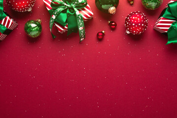 Merry Christmas and Happy Holidays greeting card, frame, banner. New Year. Red Christmas ornaments...