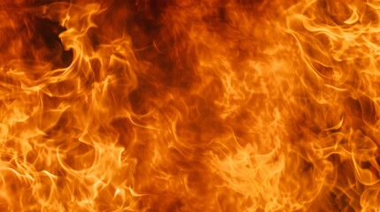 Fototapeta premium Close-up of a roaring fire with intense orange flames. Abstract burning texture background. Concept of heat, power, and danger