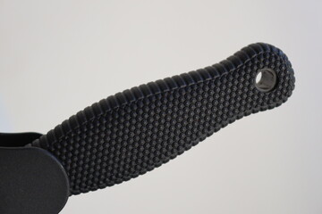 A close-up shot of a knife with a black handle, ideal for use in designs related to mystery, crime, or outdoor themes