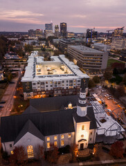 Naklejka premium Aerial view of the Raleigh , North Carolina downtown skyline at sunset looking South