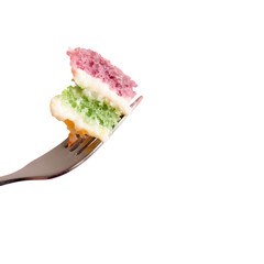 Piece of colorful layered cake on fork isolated on a transparent background.
