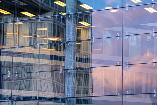 Architecture facade reflection forming a pattern of geometry in a modern glass structure with urban design elements expressed through contemporary style aesthetics