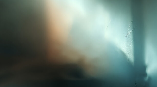 A close-up shot of a blurry figure or form enveloped in shadow, creating an intriguing atmosphere