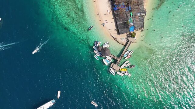 Beautiful panoramic drone view over Pulau Kelor Komodo showing crystal clear tropical ocean