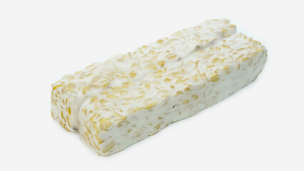 Tempeh or soybean tempeh, a source of vegetable protein made from soybeans that are boiled and given special yeast through a fermentation process until they form a solid, isolated on white background