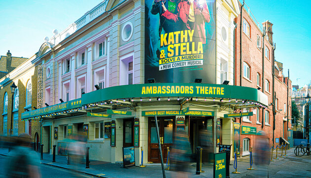 Ambassador Theater, Kathy & Stella Solve A Murder Live Stage Play, Ambassadors Theatre Exterior Sign, Performing Arts Venue, West Street, West End, London, England, United Kingdom &mdash; July 2024