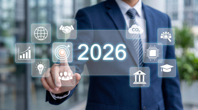 Businessman touching transparent screen with 2026 year and business icons for strategy, innovation and digital growth. - Powered by Adobe