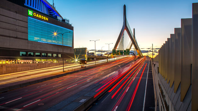 Boston landmark with the TD Garden and Zakim Bridge at sunset.