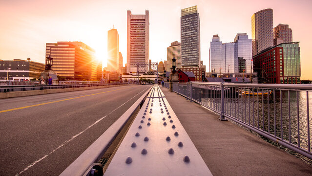 Boston architectural photo at sunset showcasing the Financial District by the Boston Harbor.