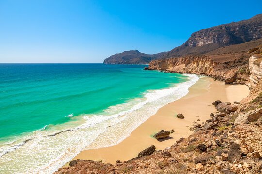 Al Fizayah Beach in Salalah is a hidden gem with its pristine white sand, crystal clear waters, and breathtaking mountainous. Secluded paradise of Oman offering a tranquil and unique beach experience.